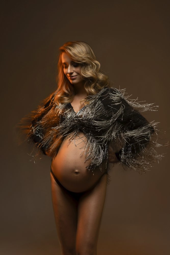 Studio maternity photoshoot in soft drapery
